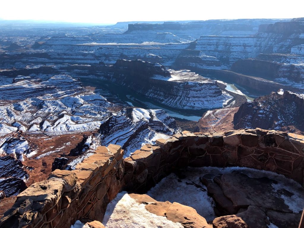 View from Dead Horse Point covered in snow. Red Rocks show beneath. 